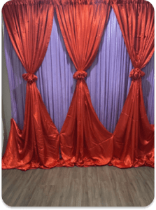 Red and purple fabric draped backdrop for rent in Ottawa