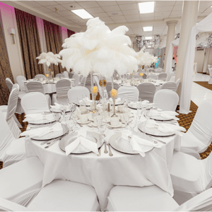 White table setting with feather centerpieces for a sophisticated event, decor rental by Decorentals2go Ottawa